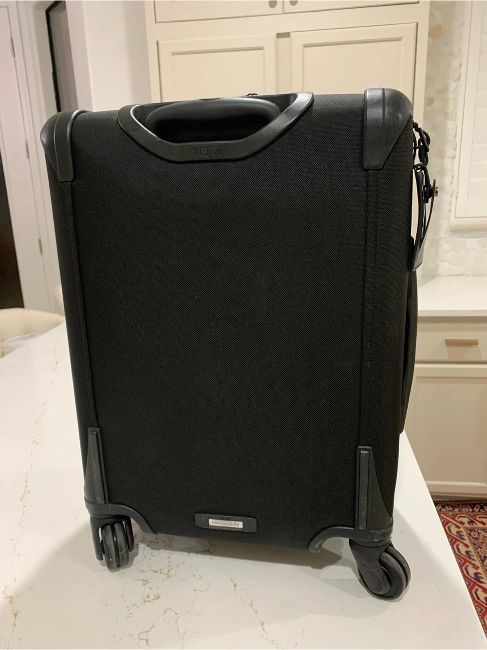 Tumi Black Spinner Carry-On with Front Zip Pocket luggage